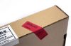 Security label stuck to a cardboard box